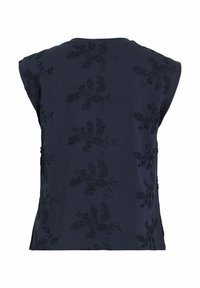 Top sans manches bleu marine avec broderie florale dans un design texturé. Il présente un col rond et des fentes latérales pour le confort et le style.