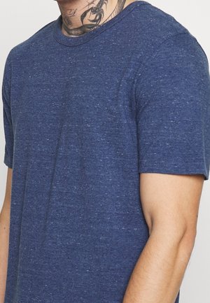 Navy blue short-sleeve t-shirt with a crew neckline. The fabric has a textured appearance with subtle flecks throughout.