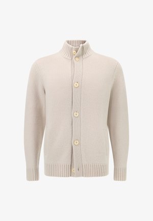 Beige neulejakku, jossa on korkea kaulus, viisi nappia, kaksi sivutaskua sekä ribattu hihansuu ja helma. Pehmeä rakenne ja rento muotoilu.