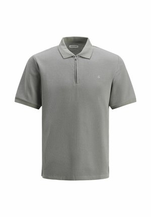 Light gray polo shirt with a zippered collar, short sleeves, textured fabric, and a small logo on the left side.