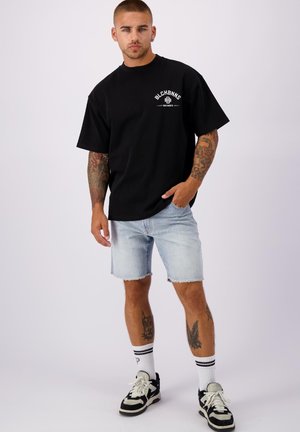 CUT OFF - Denim shorts - light blue