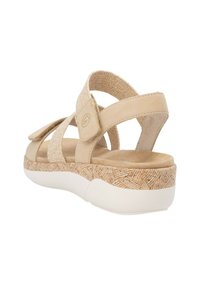 Beige sandalen met een textuur, geweven bovenkant en verstelbare banden. Voorzien van een gevoerd voetbed en een patroon, lichtgewicht witte zool.