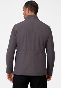 Gray, lightweight jacket with long sleeves and a structured collar. Features a cinched waist and visible stitching detail. Back view shown.