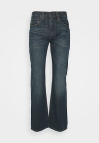 Jeans de mezclilla azul oscuro con un diseño de pierna recta, que cuentan con bolsillos frontales y costuras decorativas a lo largo de la cintura y las costuras.