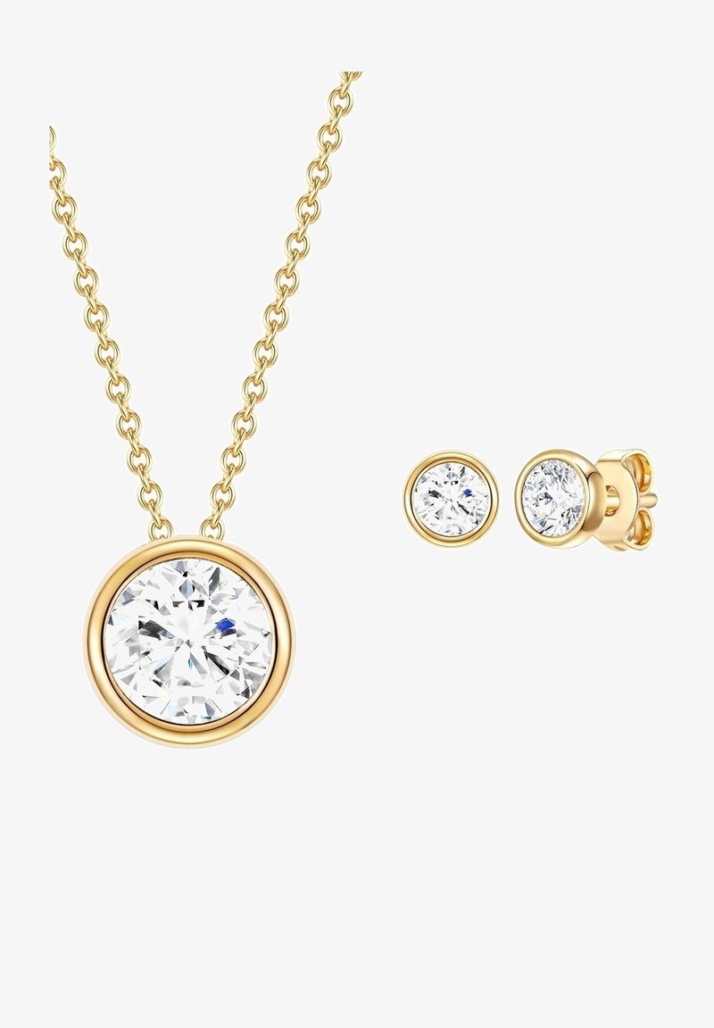 Kuldse tooniga kaelakee, millel on suur ümmargune selge gemstone ripats; sobivad ümmargused kõrvarõngad kuldsetes istmetes koos selgete gemstone'idega.