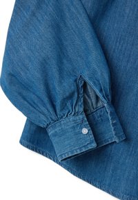 Denim shirt with long, gathered sleeves. Deep blue color, buttoned cuff, and a slightly textured fabric. Visible stitching details.
