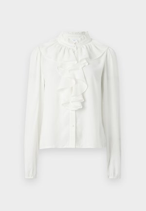 Hvit bluse med lange ermer, høy volangkrage og volangdetaljer foran. Stoffet ser glatt ut med en svak glans og knappestenging.