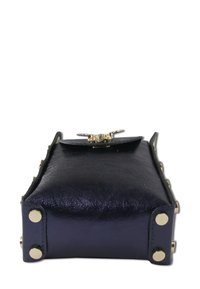 Navy leather handbag with a shiny finish, featuring gold hardware, rounded corners, and metal studs on the sides. Closure with decorative flap.