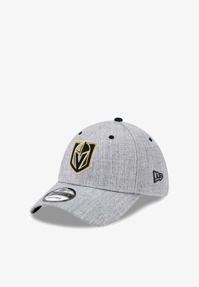 Gray fitted baseball cap with a textured fabric, featuring a black and gold embroidered logo on the front and a black adjustable strap.