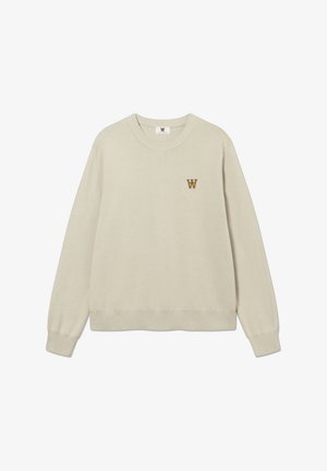 Sweat-shirt beige, col rond, poignets et ourlet côtelés, avec un petit logo "W" marron sur la poitrine. Tissu doux et texturé.
