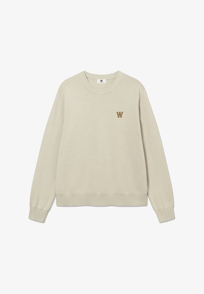 Sweat-shirt beige, col rond, poignets et ourlet côtelés, avec un petit logo "W" marron sur la poitrine. Tissu doux et texturé.