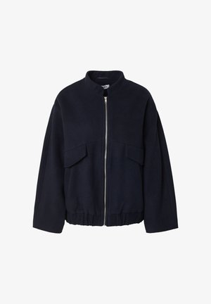 Navy blue fleece jacket with a high collar, front zipper, and two large patch pockets on the chest. Elasticated hem for fit.