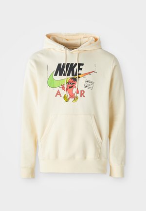 Hooded sweatshirt in light cream with a front graphic featuring a character, Nike logo, and "AIR" text. Kangaroo pocket and ribbed cuffs.