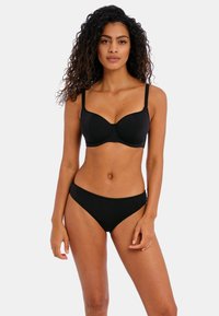Set di bikini nero con top imbottito a sostegno con spalline regolabili e slip coordinati. Texture liscia, design minimalista.
