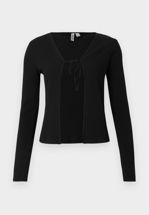 Melnas ribotas garām piedurknēm kardigans ar V-veida kakla izgriezumu un sasienamu aizdari priekšpusē. Mīksta tekstūra, piegulošs dizains un viegls materiāls.
