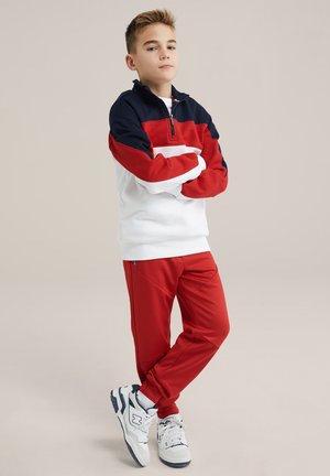 BAD BOYS - Tracksuit bottoms - fire red