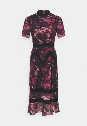 Dress with short sleeves, high neck, and floral pattern in dark reds and pinks, featuring sheer hem and black lace trim accents.