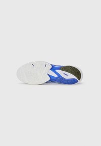 Athletic shoe sole in blue, white, and olive green. Features textured rubber with a unique tread pattern for grip and durability.