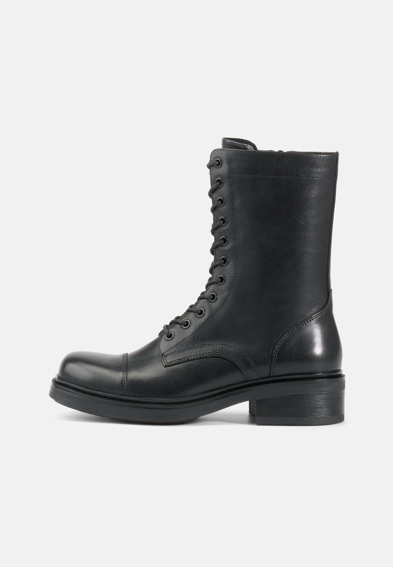 Black leather lace-up ankle boot with a rounded toe, textured surface, and a low stacked heel. Features 10 eyelets and reinforced stitching.