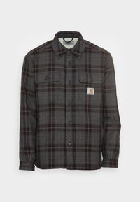 Sort og grå plaid skjorte lavet af vævet stof, med to brystlommer, lange ærmer og knaplukning foran med et logo-patch.