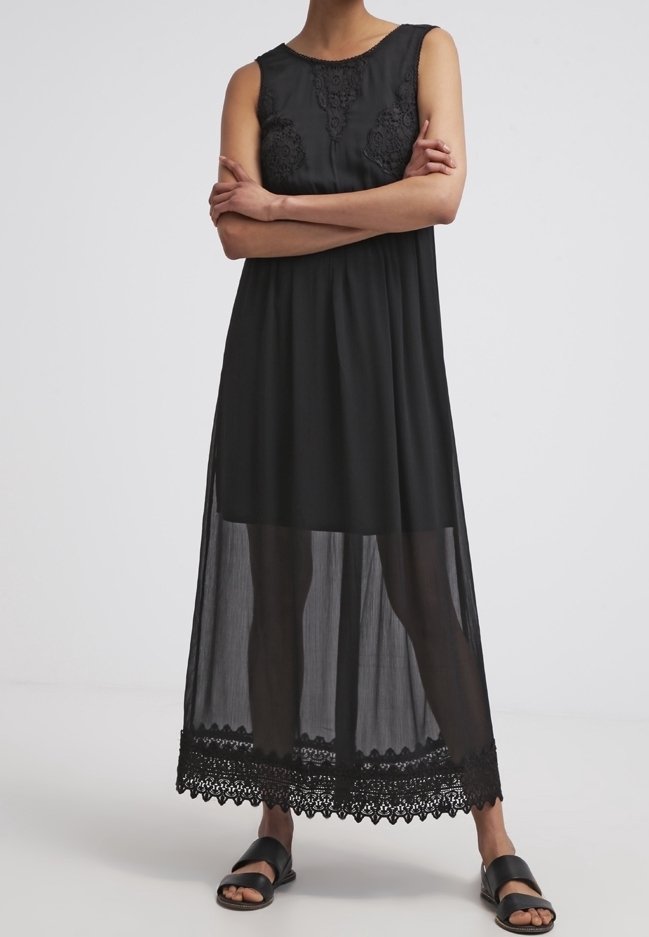 Svart ärmlös maxiklänning med blommig spetsdetalj vid bysten och nederkanten, med en genomskinlig överdel och scalloped-kant.