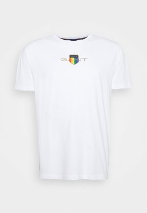 White short-sleeve crew neck t-shirt with a colorful shield and "GANT 1949" logo centered on the chest.
