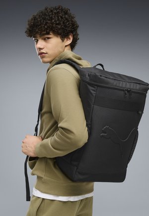Puma, BUZZ UNISEX, czarny