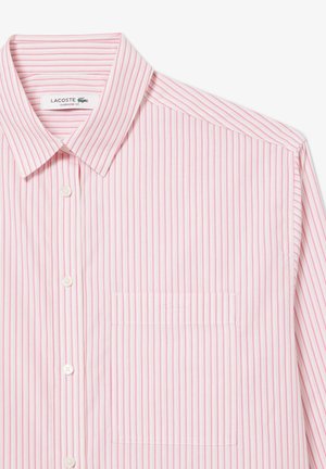 Ribade särg roosa ja valge vertikaalse triibuga. Omab kraed, taskut ja pehmet kangast tekstuuri. Silt: Lacoste Üks suurus.