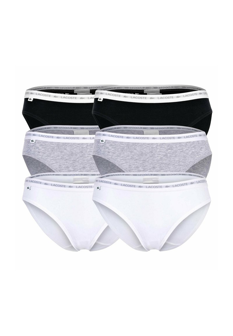 Zestaw sześciu damskich majtek w kolorze czarnym, szarym i białym. Posiadają miękką elastyczną talię z logo Lacoste oraz materiał bawełniany dla zapewnienia komfortu.