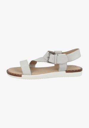 Light grey sandal with a strappy design, silver buckle, and white rubber sole. Features a soft footbed and decorative studs along the edge.