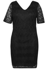 Svart spetsklänning med V-ringning, korta ärmar och figurnära silhuett. Spetsen har ett vågmönster och en texturerad yta.