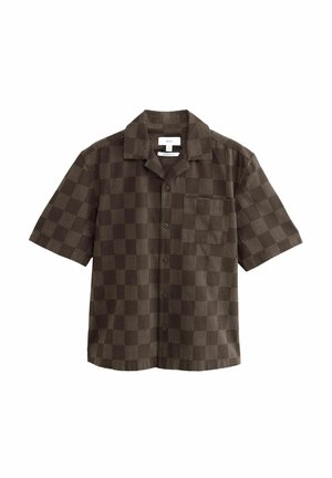 Brown short-sleeve shirt featuring a checkerboard pattern with textured squares and a single chest pocket. Button closure at the front.