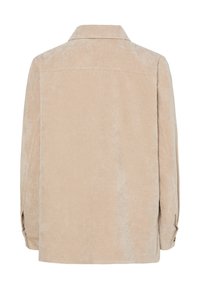 Chemise beige en velours côtelé à manches longues avec poignets boutonnés, vue de dos sur fond blanc.