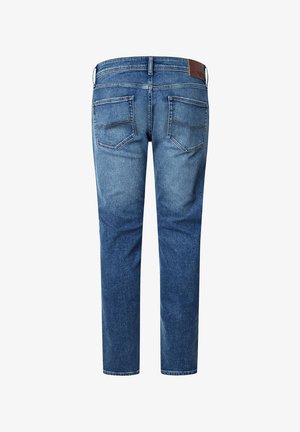Jeans gemaakt van licht tot medium gewassen denim, met een rechte pijp, twee achterzakken en een bruine leren patch op de tailleband.