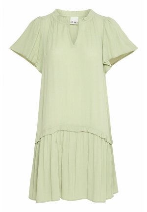 Light green short-sleeved dress with a v-neck, gathered detailing, and a flared skirt featuring a ruffled hem and pleated texture.