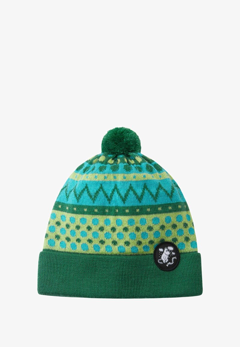 Knitted beanie in teal and green with a pom-pom on top. Features geometric patterns, polka dots, and a black circular logo patch.