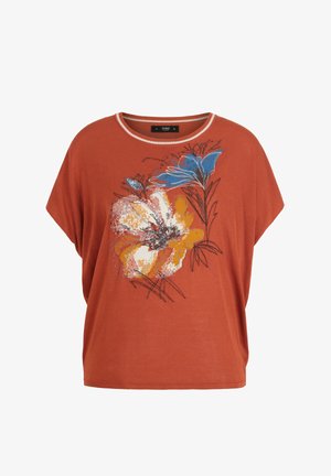 Rust-colored short-sleeve top with round neckline, featuring large abstract floral design in blue, orange, white, and black on the front.