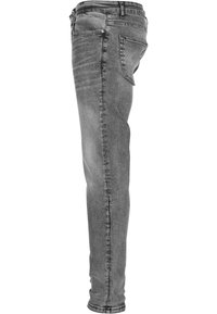 Uske slim-fit sivi traperice sa klasičnim dizajnom od pet džepova, blagim izbljeđivanjem i suženim nogavicama. Mekana tekstura s glatkom završnom obradom.