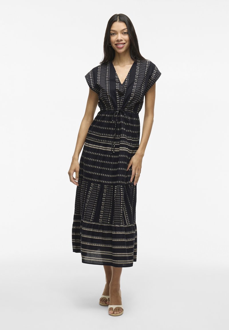 Abito lungo navy con strisce a fantasia in beige. Presenta maniche corte, scollatura a V e una vita con coulisse per una vestibilità regolabile.