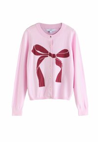 Pink knitted cardigan featuring a large burgundy bow design on the front. It has a round neckline and gold buttons.