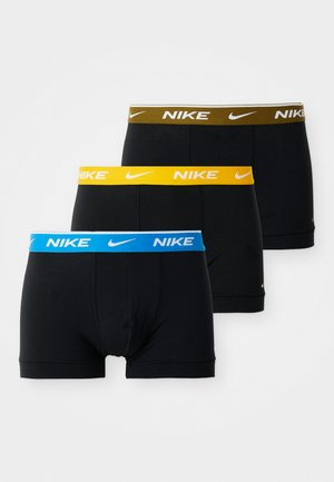 Kolm paari musti bokserpükse elastse vöökohtadega, sinise, kollase ja rohelise värviga, mille igal vööl on valge Nike logo.