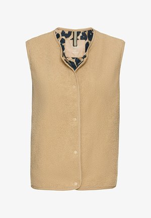 Beige fleece vest med rundet krave, front snap-lukninger og leopardprint-foring. Blød tekstur og ærmeløs design.