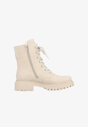 Botte de cheville en cuir beige imperméable avec une semelle robuste, un laçage à l'avant et un zip sur le côté. Texture lisse et design résistant.