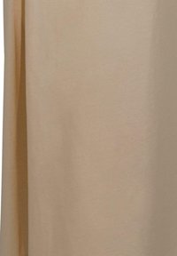 Beige fabric curtain with a soft texture, hanging straight with subtle shadows along the creases.