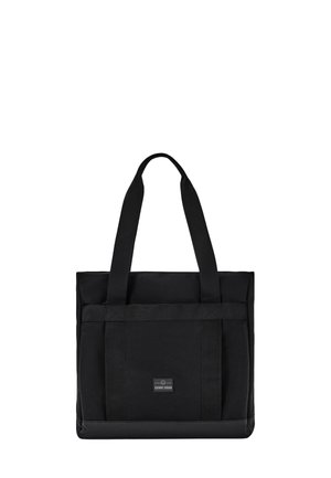Borsa tote in stoffa nera con manici lunghi, fondo rinforzato e una piccola cucitura rettangolare con il logo "Johnny Urban" sul davanti.