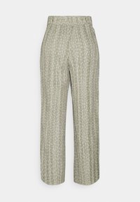 Pantalon plissé vert clair avec motif vertical à pois blancs, taille élastique et jambes larges, photographié sur un fond blanc uni.
