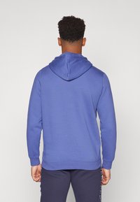 Puma COLOR LOGO HOODIE  - Pulover s kapuco - blue crystal