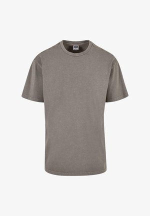 Hallhallane puuvillane t-särk ümmarguse kaeluse ja lühikeste varrukatega, peene tekstuuriga ja sirge alläärega. Mustreid ega aktsente pole.