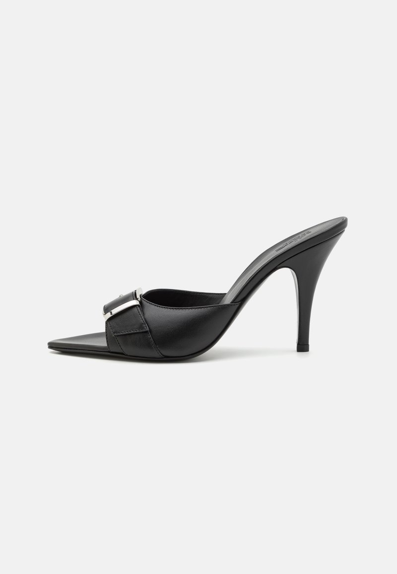 Black leather high-heeled mule with a pointed toe, decorative silver buckle detail, and a slim stiletto heel. Smooth texture throughout.