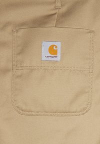 Carhartt WIP ABBOTT PANT DENISON - Calças - leather rinsed